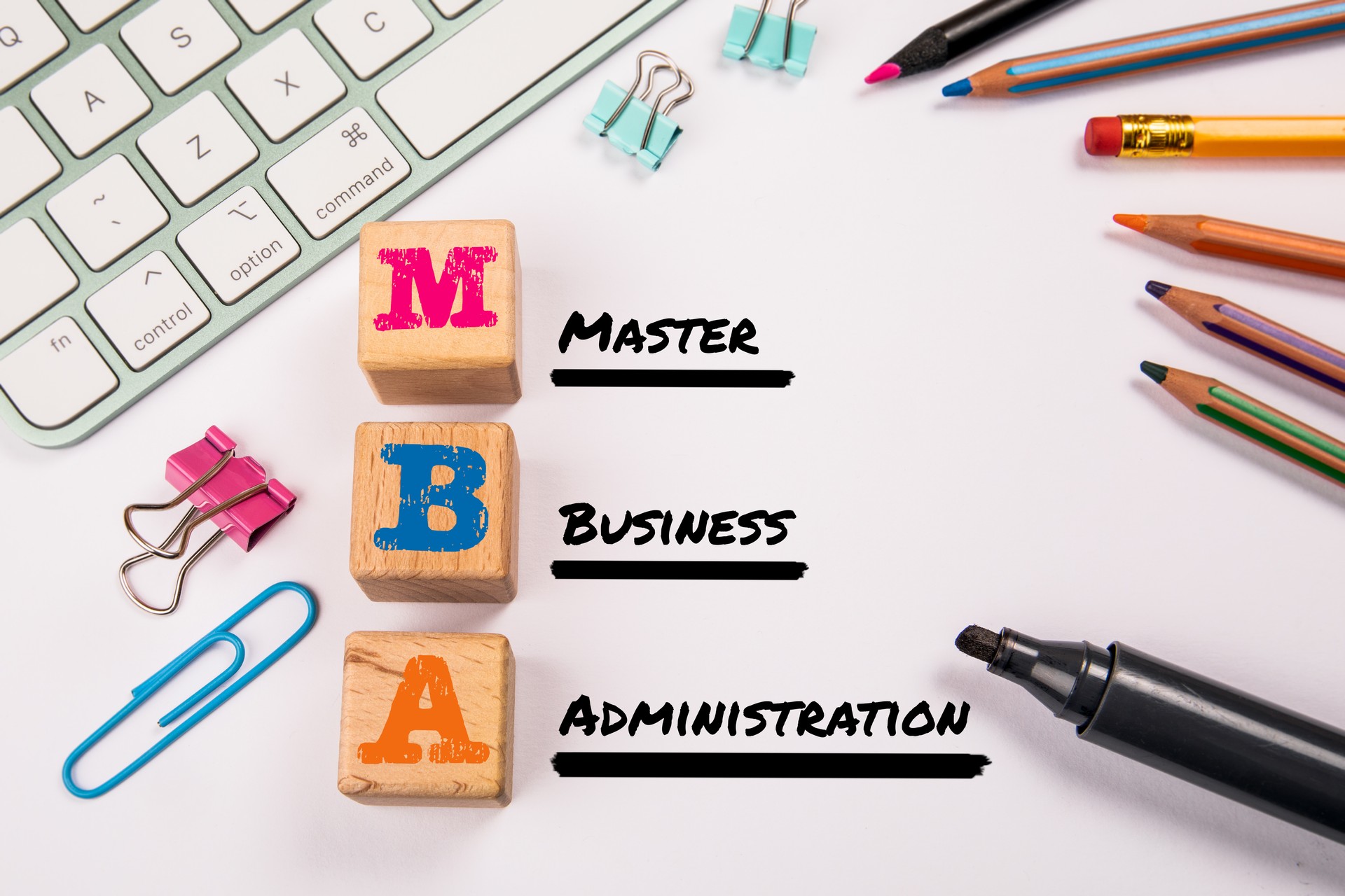 MBA - Master of Business Administration. Wooden blocks on a white office table